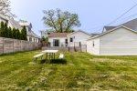 Large grassy yard with picnic table